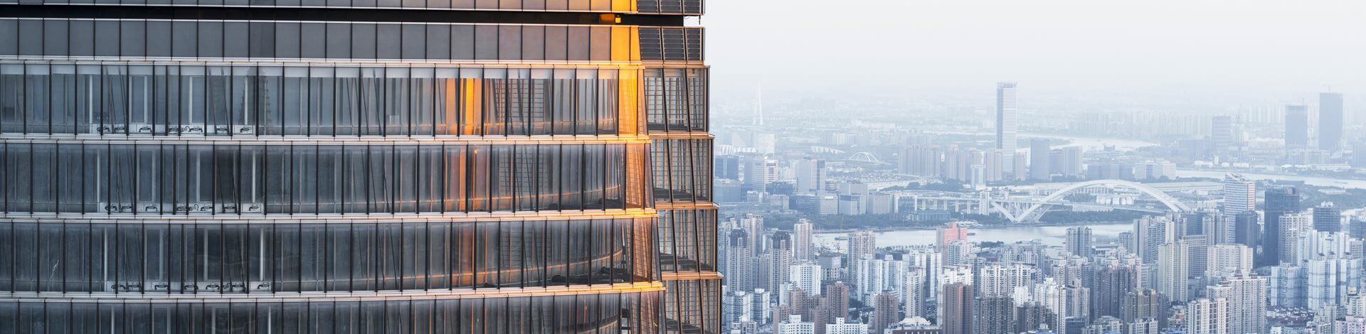 Close-up of skyscraper with Shanghai in the background