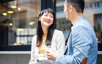 Couple smiling over a coffee