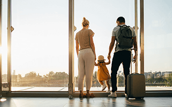 family of three in the airport